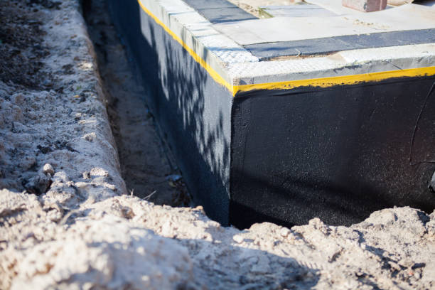 Professional Basement Waterproofing technician working in Eagleville, PA